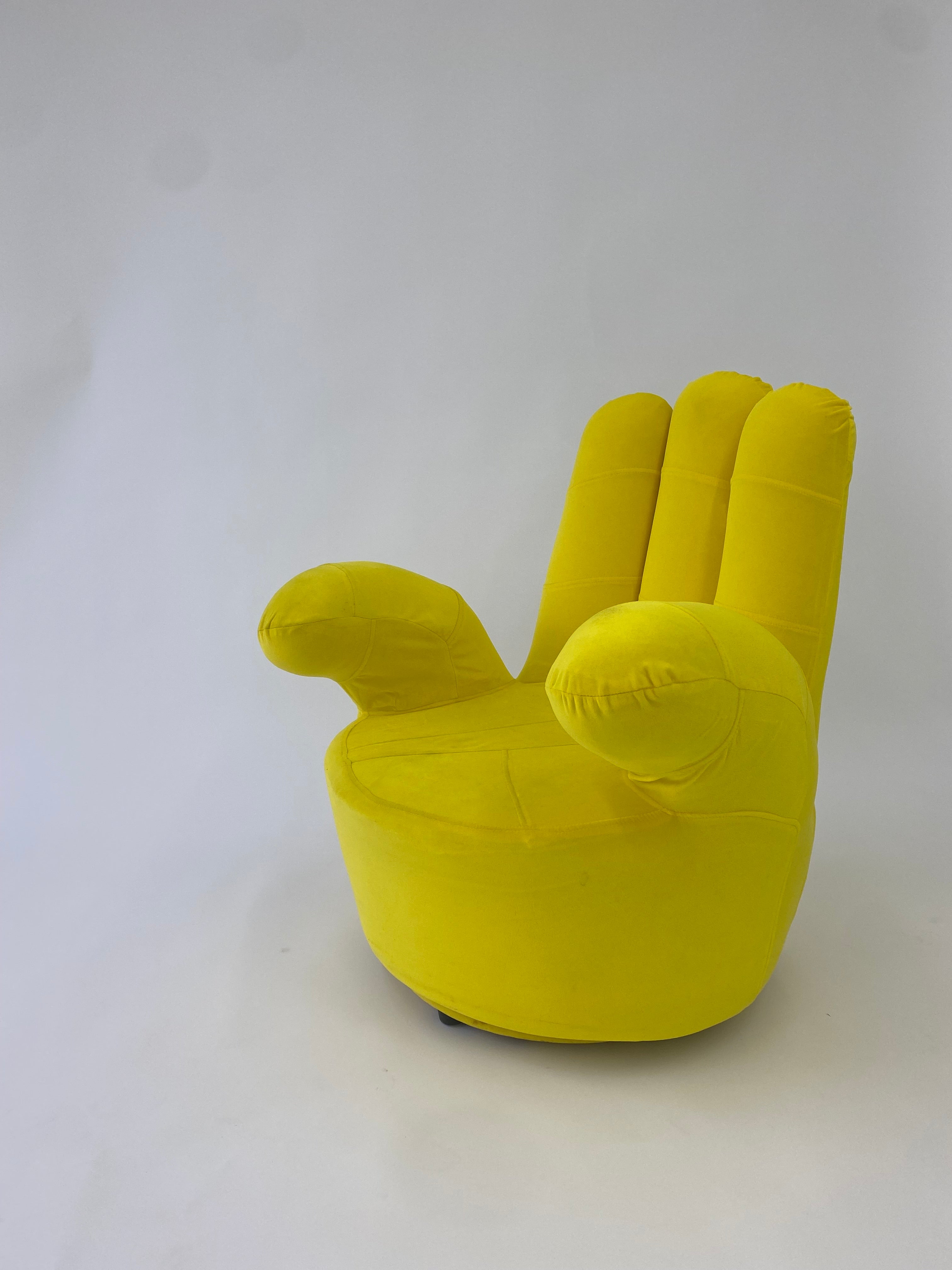 Yellow Suede Hand Shaped Swivel Chair Tossed